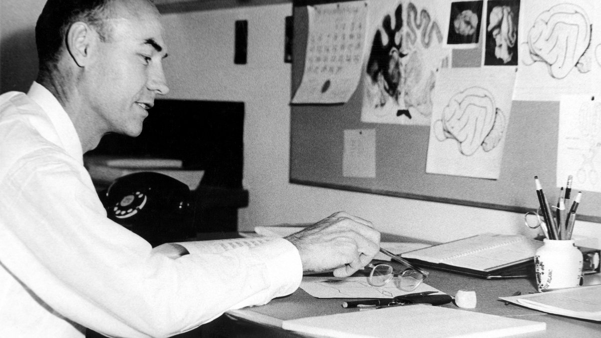 Roger Sperry working at a desk