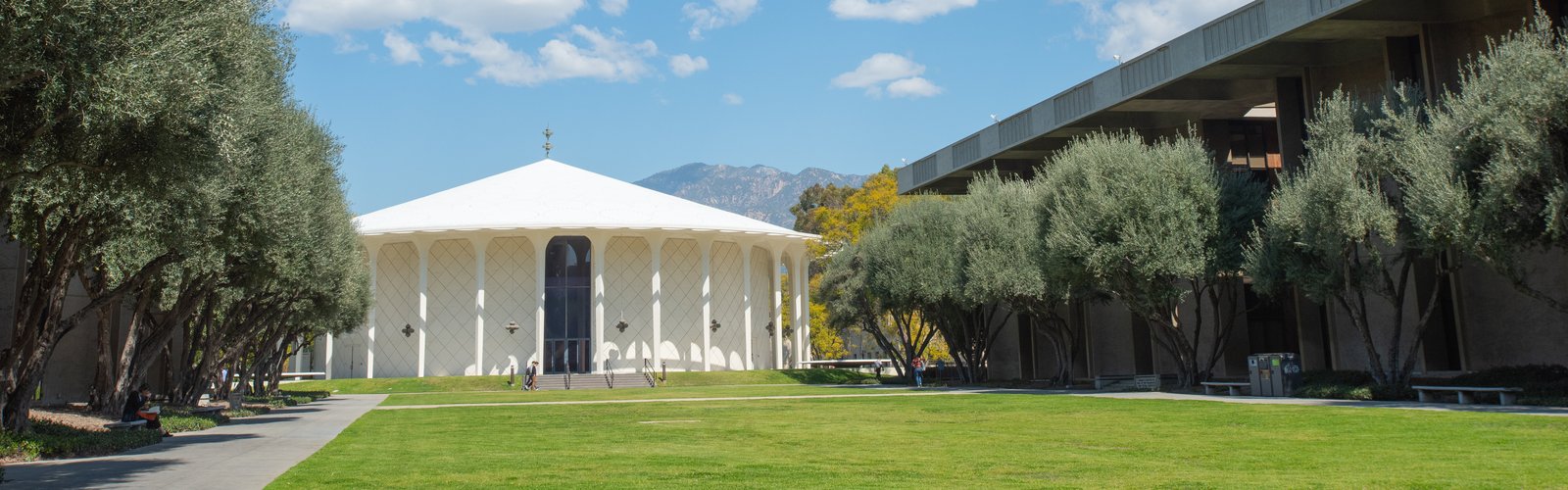 Beckman auditorium, blue sky, white clouds
