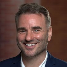 headshot of man with brown hair