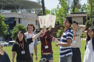 Students holding signs