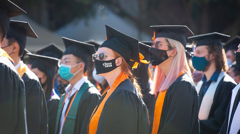 Graduates listen during October 2021 commencement.