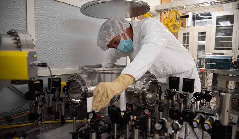 Researcher fine tunes the samples in the chamber.