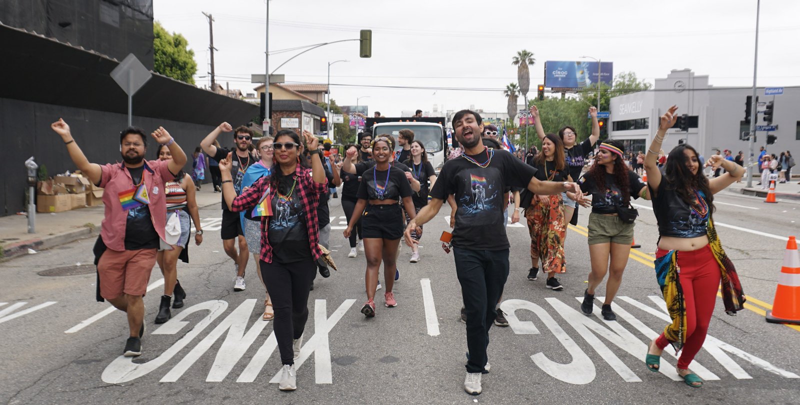 Caltech parade participants dance joyfully through the streets of Hollywood.