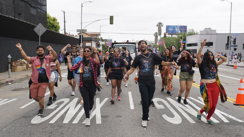Caltech parade participants dance joyfully through the streets of Hollywood.