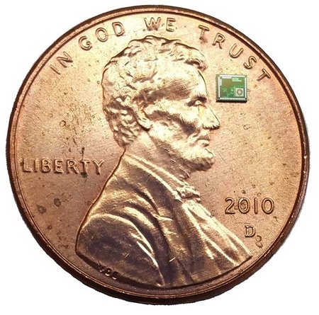 microchip next to a penny