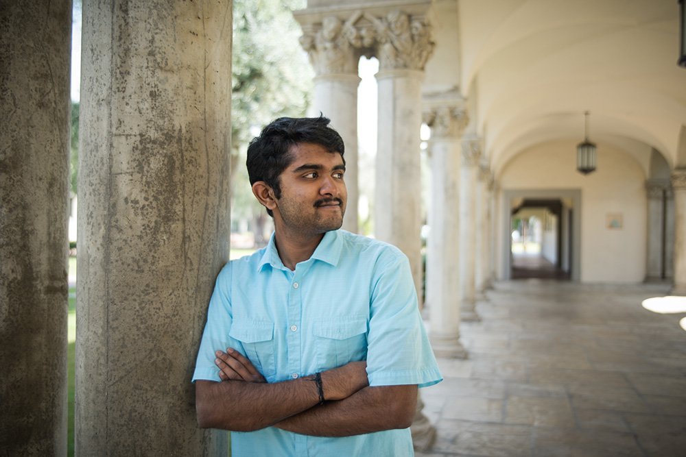 Senior Aadith Moorthy leans against a pillar