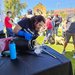 Arian Jadbabaie pours liquid nitrogen on a ceramic puck