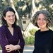 A portrait of professors Dehn Gilmore and Hillary Mushkin in a garden with trees