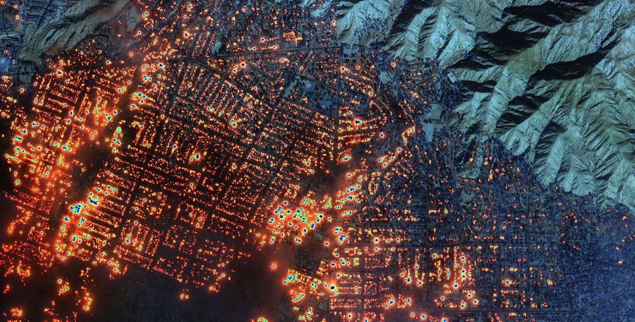 A composite satellite image of the Eaton fire burning in Altadena, California