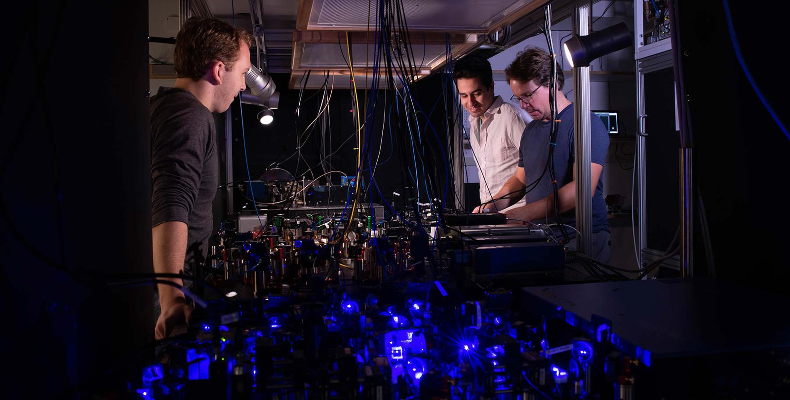 Adam Shaw, Ivaylo Madjarov, and Manuel Endres in the lab.