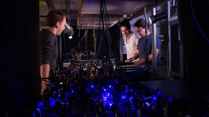 Adam Shaw, Ivaylo Madjarov, and Manuel Endres in the lab.
