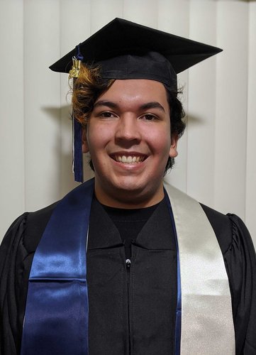 A portrait of Erik Herrera wearing a graduation robe and mortarboard