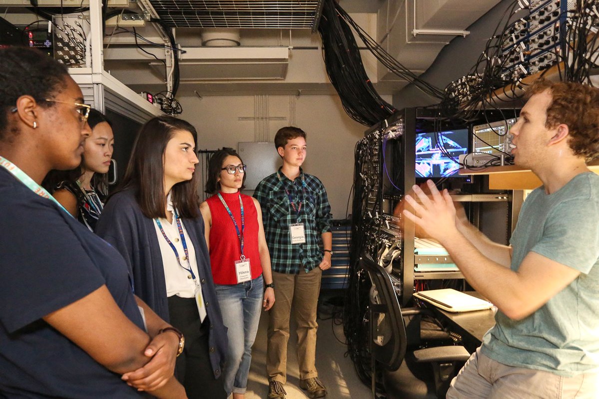 Graduate student Adam Shaw talks to prospective graduate students