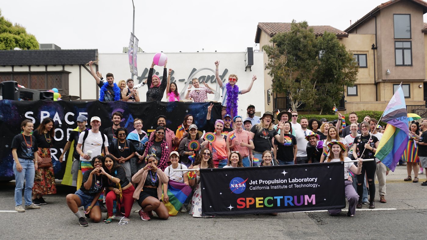 Caltech and JPL participants in the parade pose for a photo together.