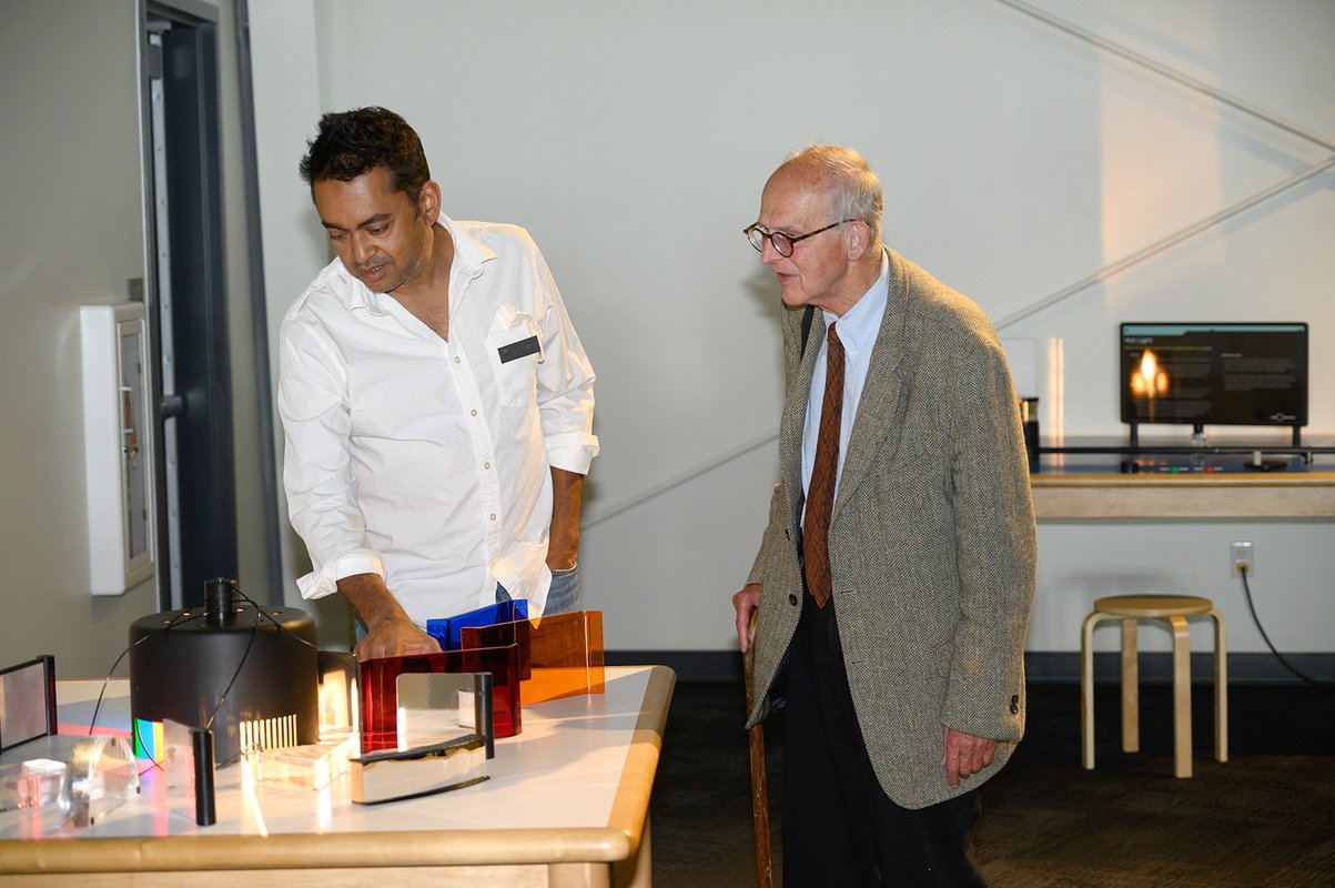 Rana Adhikari of Caltech and Rai Weiss of MIT discuss one of the new exhibits at the center.