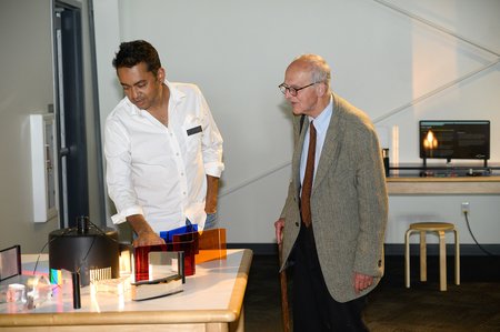 Rana Adhikari of Caltech and Rai Weiss of MIT discuss one of the new exhibits at the center.