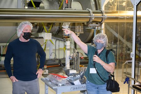 Mike Landry and Betsy Weaver of LIGO Hanford give visitors of a tour of the facility.