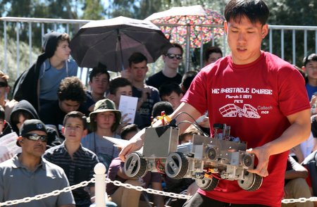 Kyung Park, of Team Soul, places a robot for one of the early heats.