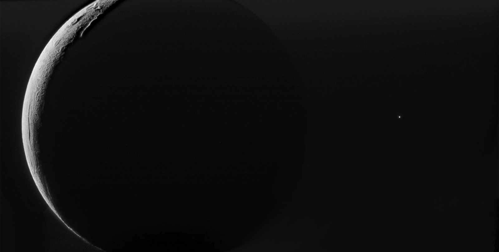 Black and white image of a large sphere in front of lines