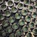 A patterning of cylindrical wells with small green electrodes inside