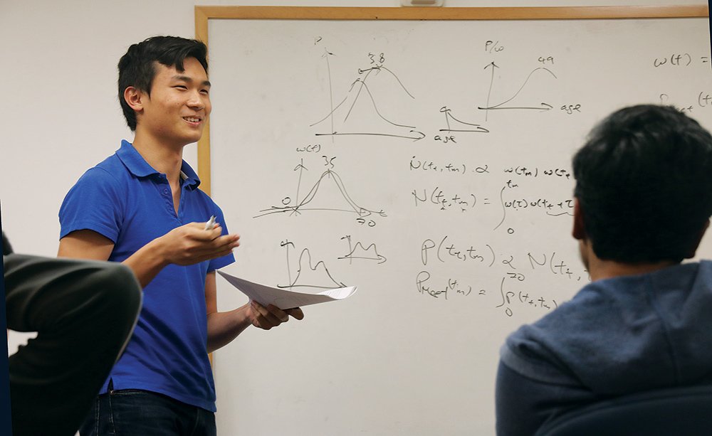 photo of Daniel Mark at a white board