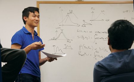photo of Daniel Mark at a white board