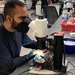 A person looking into a microscope