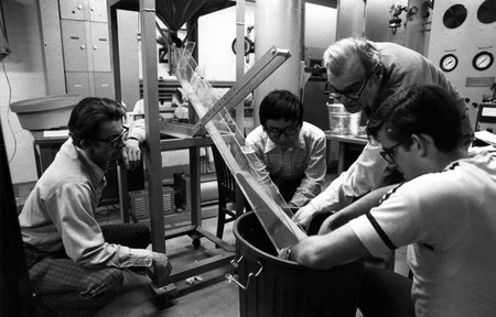 photo of Rolf Sabersky and three others observing sand flow