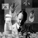 A person at a lab bench with illustrations of fruit flies