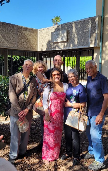The Venerable family outside Venerable House at Caltech