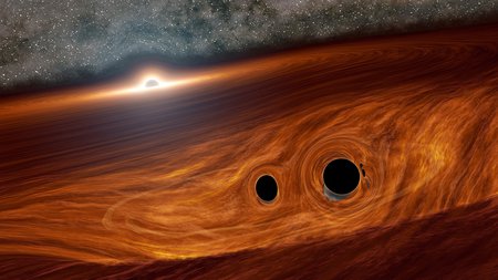 Artist's concept of a supermassive black hole, with a binary pair of black holes in its disk.