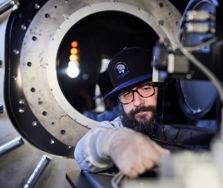 A picture of Phil Korngut working on the instrument.