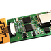 An orange-and-black sensor attached to a small circuit board.