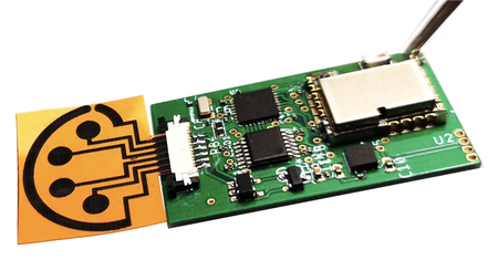 An orange-and-black sensor attached to a small circuit board.