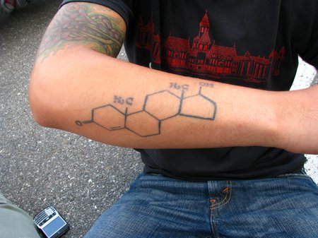 A man's forearm with a tattoo of the testosterone molecule