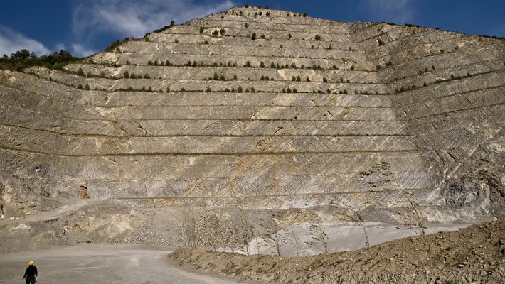 A pyramid shaped rocky cut into the ground