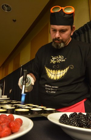 Chef flaming a creme brulle