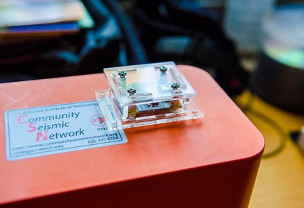 Closeup of an orange Community Seismic Network sensor