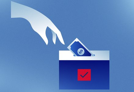 Someone donating money to a donation box