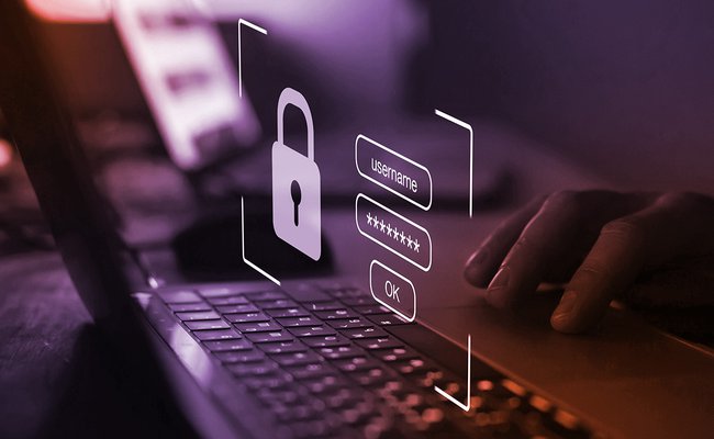 stylized photo of a person logging into a laptop with username and password and an image of a key