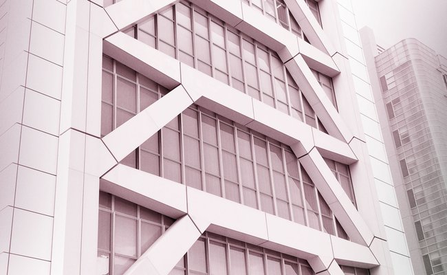 Filtered close-up of a tall building with earthquake-resistant reinforcement in Japan