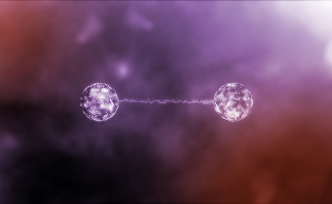 Artist concept of two entangled objects. Two glowing orbs are attached by a string of light.