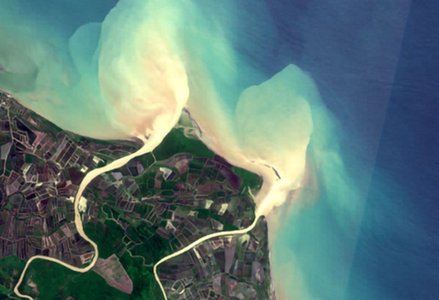 Satellite view of a river avulsion, whereby the river abruptly and catastrophically changed its course to the ocean.