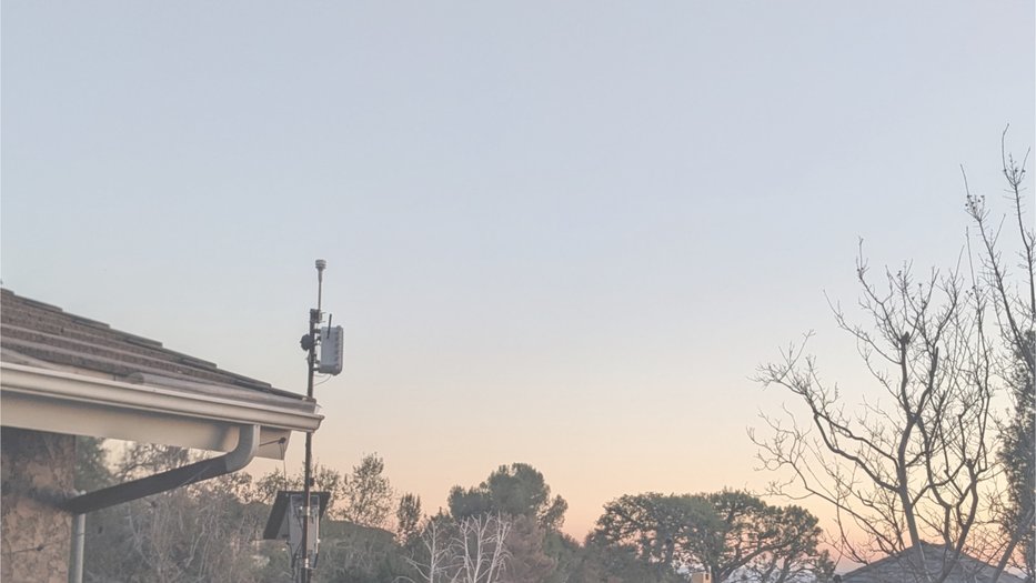 View of mountains from a roofto with an air sensor installed
