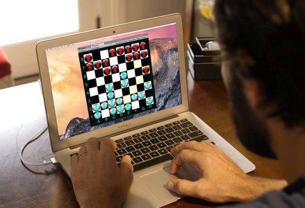 A laptop screen with a quantum chess game on it