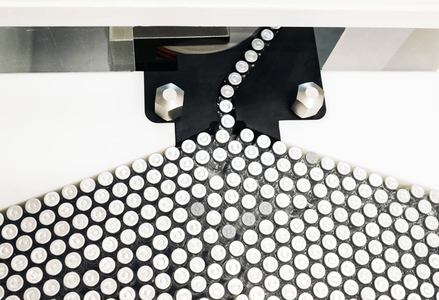 vaccines on a conveyor belt