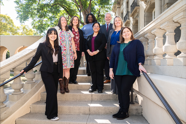 The CTLO team standing and smiling together on campus.