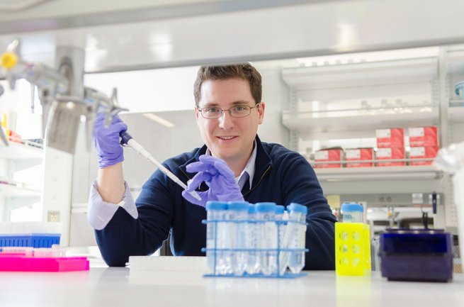 Mitch Guttman working in the biology lab.