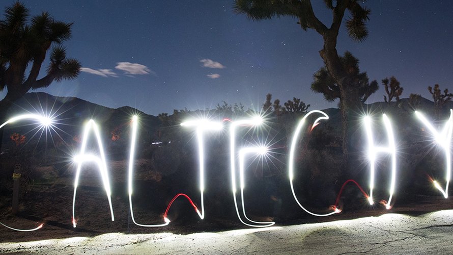 "Caltech Y" spelled with light in long exposure photo of the desert at night.