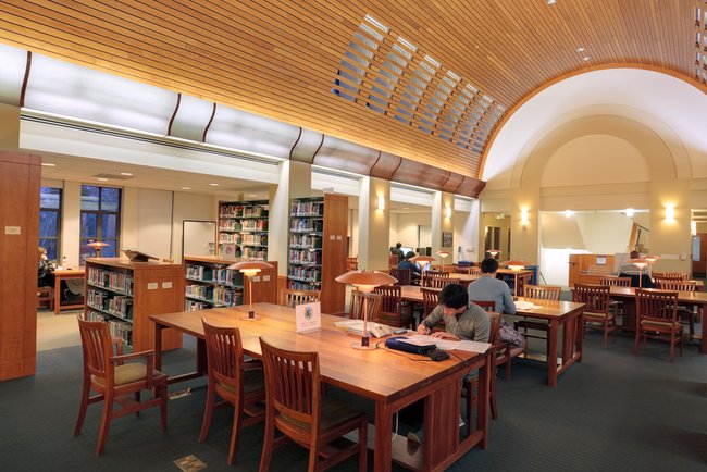 Interior photo of Sherman Fairchild Library with students working.